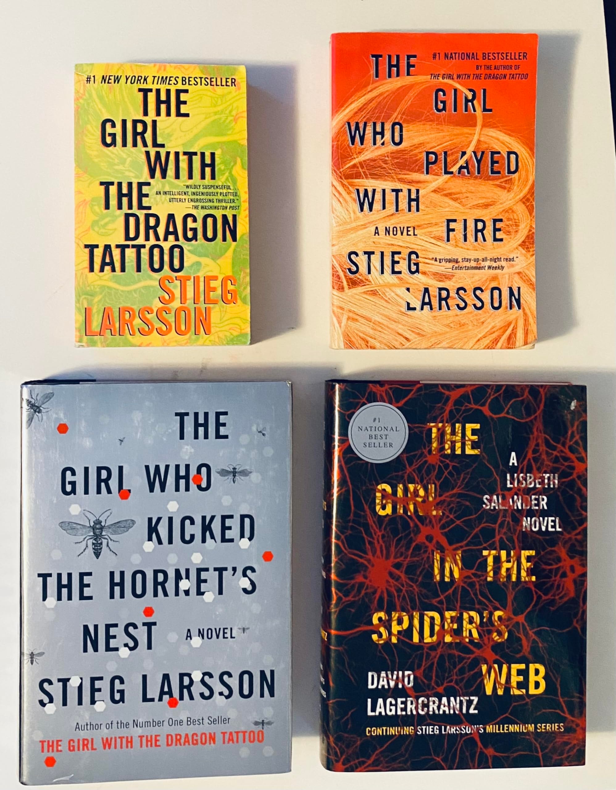 4 Stieg Larsson's Millennium Series Books! 1) The Girl with the Dragon Tattoo 2) The Girl Who Played with Fire 3) The Girl Who Kicked the Hornet's Nest 4) The Girl in the Spider's Web